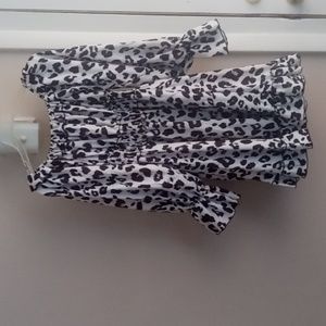 A black and white mini dress long sleeve that comes off the shoulder